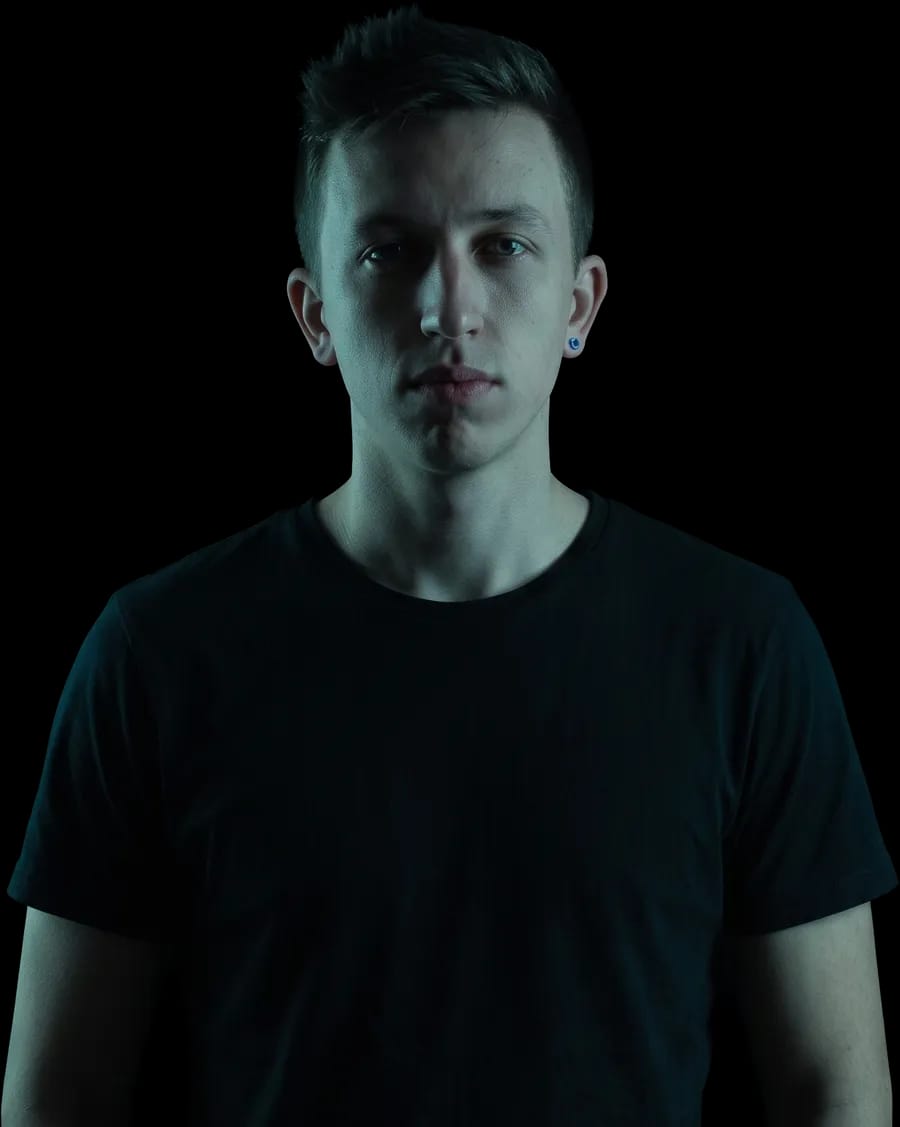 Tyler Jordan facing the camera in a black t-shirt